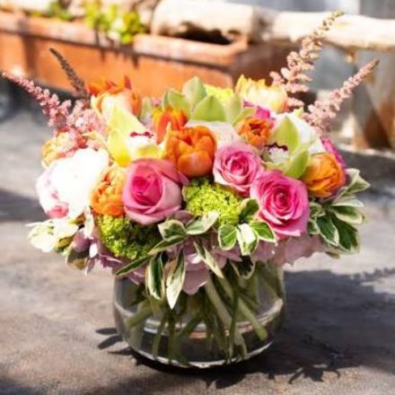 Custom floral arrangement being built by a florist